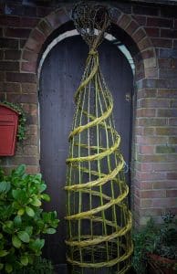 Plant support willlow weaving workshop at Holkham in north Norfolk