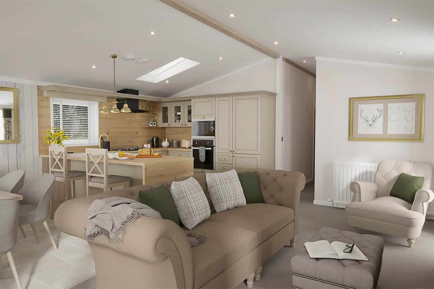 An interior photo of a lodge, showing comfy beige sofas and a cream kitchen in the background.