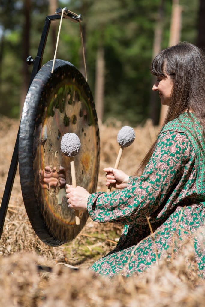 Gong playing at the wellness day at Holkham, north Norfolk